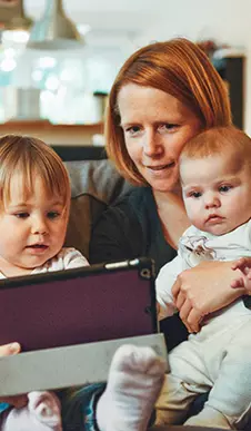Mother and children on tablet