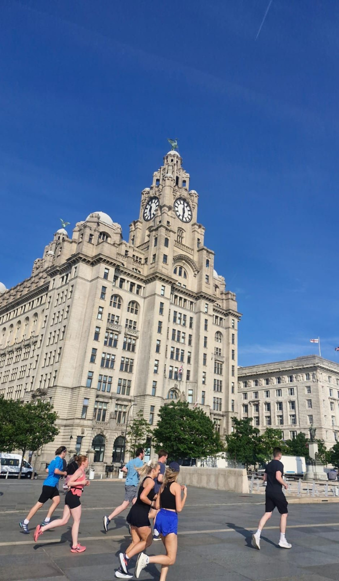 A group of people running in Liverpool