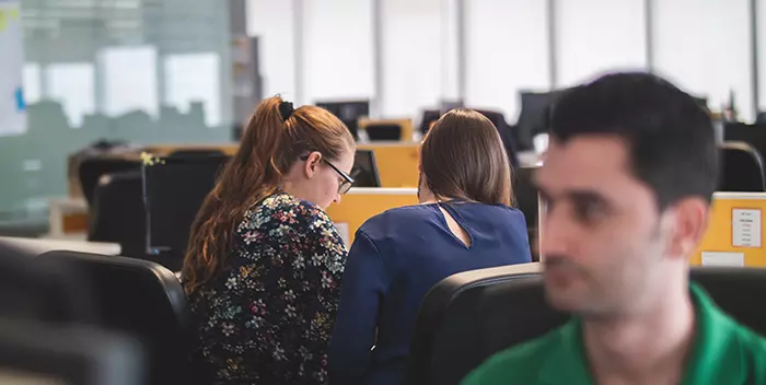 Colleagues working at a desk