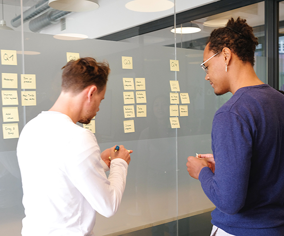 Colleagues using sticky notes