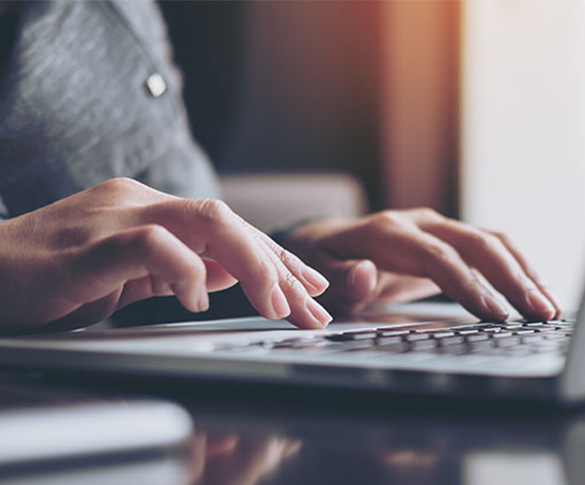 0758 Working on laptop 585px x 485px